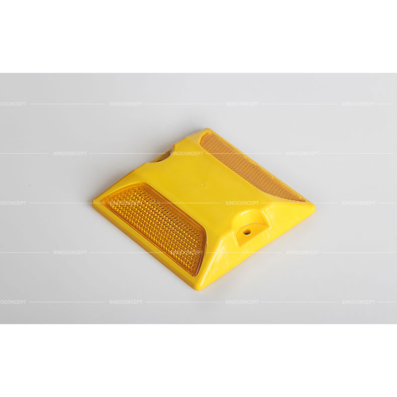 Yellow plastic reflective road stud also called traffic road stud used on the road as a road safety equipment
