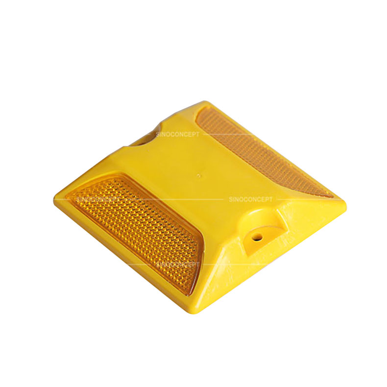 Yellow plastic reflective road stud also called traffic road stud used on the road as a road safety equipment