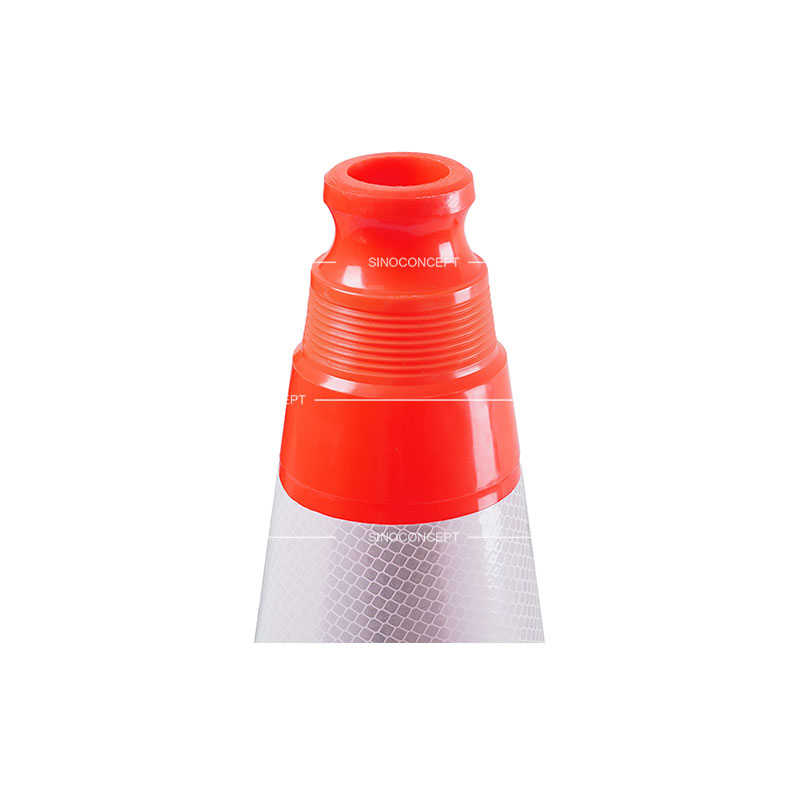 A close-up of the top of a 500mm weighted orange traffic cone featuring reflective films.