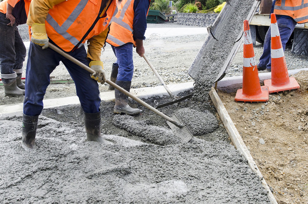Some workers are making a concrete speed bump