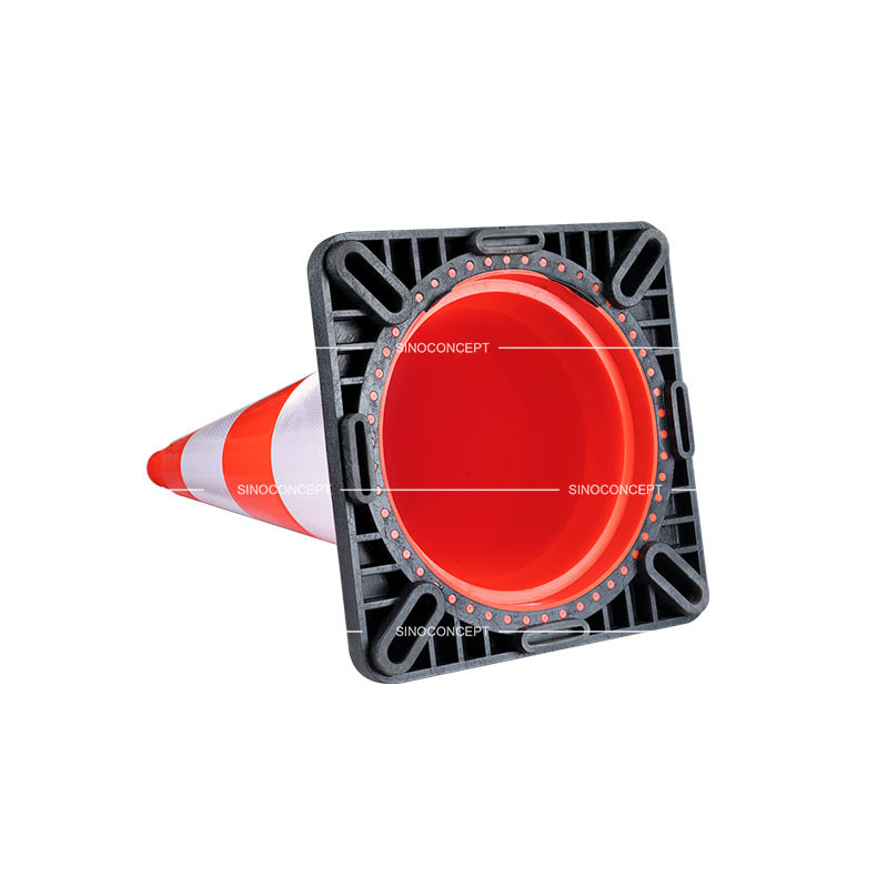 Bottom view of the black rubber base for orange PVC traffic cones also called road safety traffic cones.