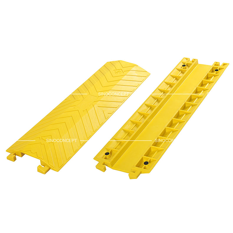 Large yellow drop over cable protectors made of polyurethane designed with skidproof surface and four black anti-slip pads