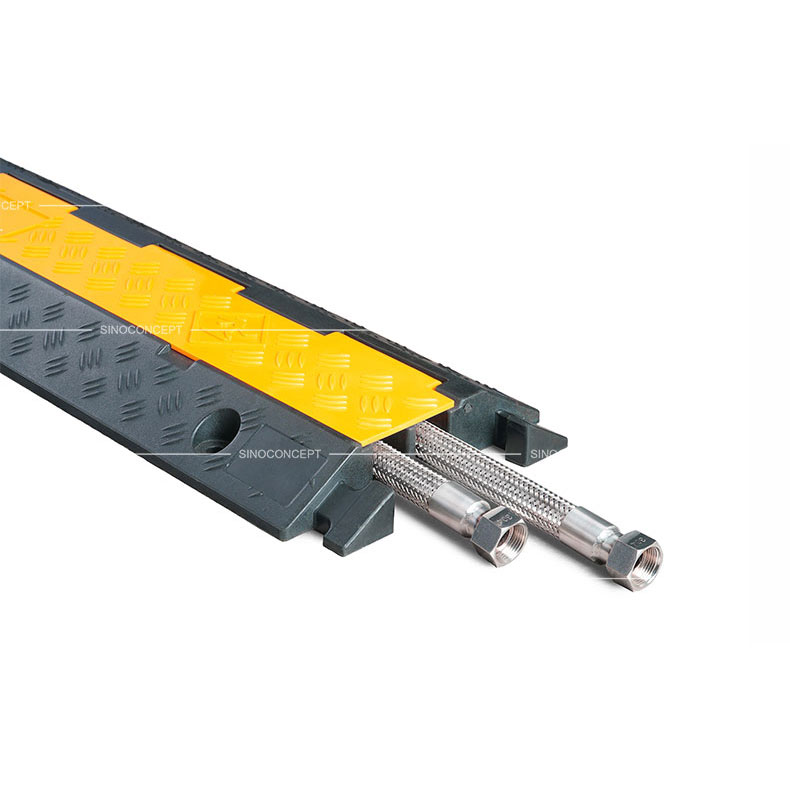 A 2-channel cable ramp made of rubber with anti-slip surface and yellow plastic covers.