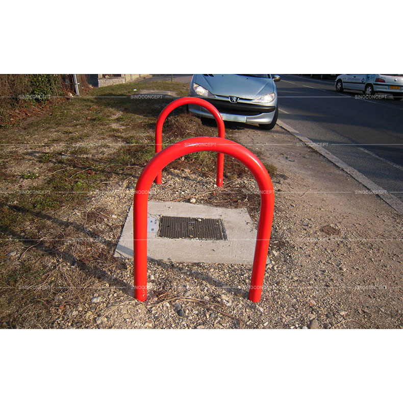 Red lamp post protectors hoops that protect lamp posts and columns to offer lamp post protection.