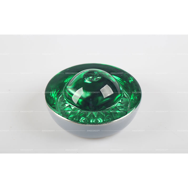 Big size green glass road stud also called road reflector made of glass and steel used on the road as a road safety equipment