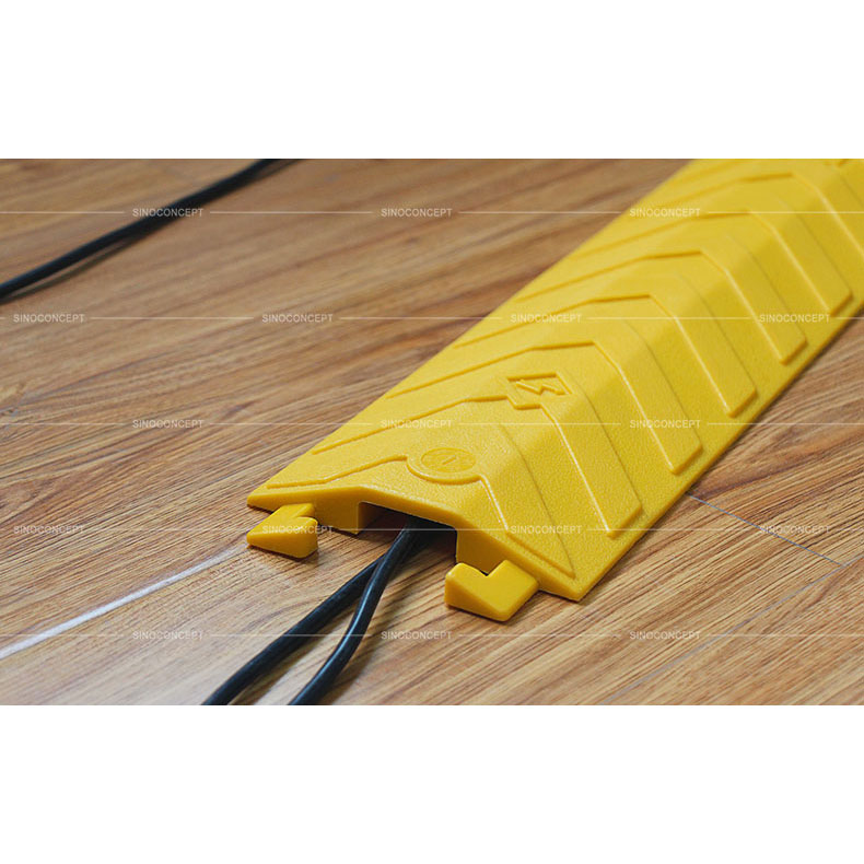 Yellow floor cable protector made of polyurethane with one channel to protect cables, designed with anti-slip surface