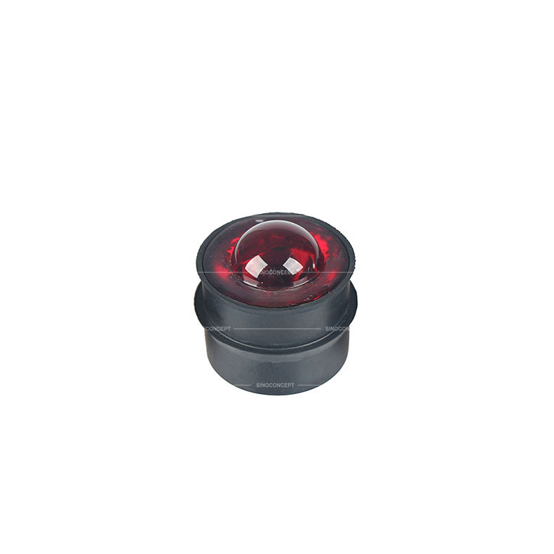 Red glass traffic road stud also called reflective road stud made of glass and steel used as a traffic safety device