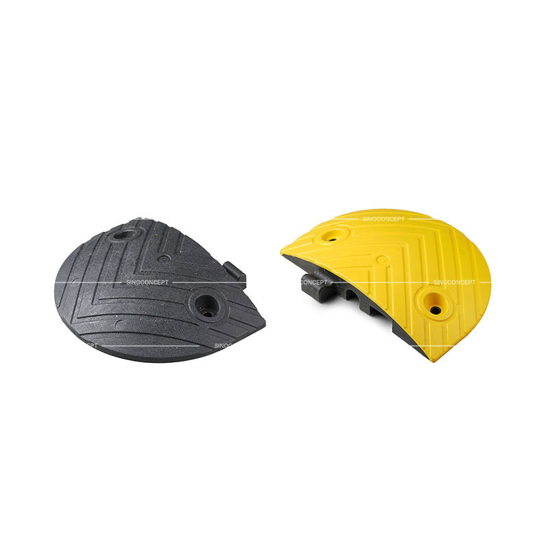 A black and a yellow end parts of a 5cm height Plastic-Rubber composite speed bump.